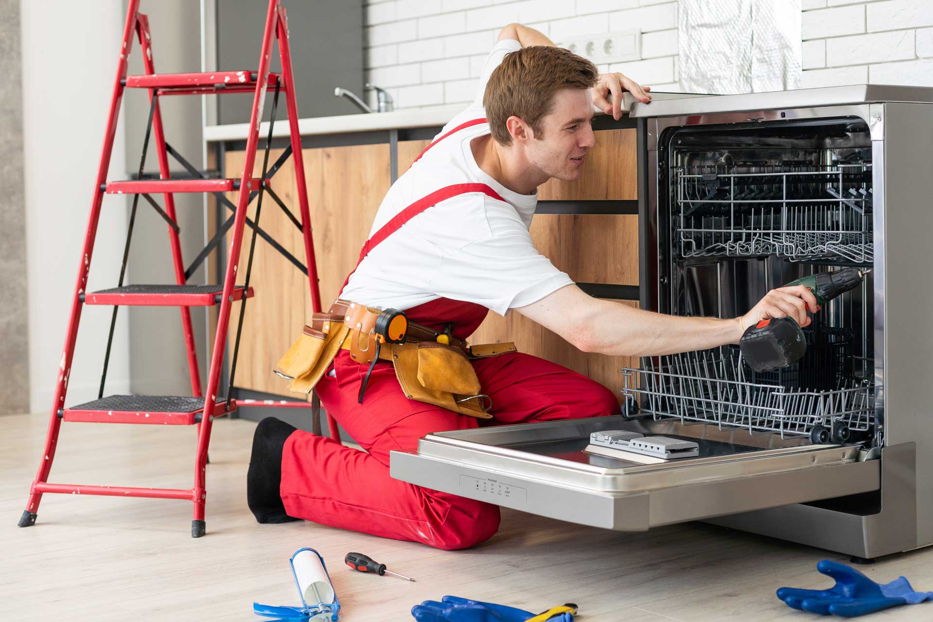 technician repairing washing machine in North Palm Beach